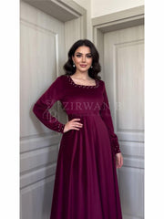 Luxurious Long-Sleeve Velvet Gown with Beaded Neckline and Cuffs