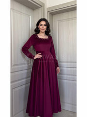 Luxurious Long-Sleeve Velvet Gown with Beaded Neckline and Cuffs